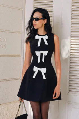 Bow Embellished Mini Dress | Chic & Playful | Elegant Statement
